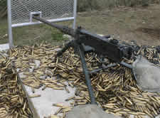M2 Machine Gun on the firing range, surrounded by spent ammunition casings.