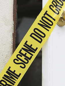 A door with crime scene tape across it