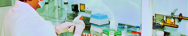 DNA technician processing biological sample in a laboratory setting.