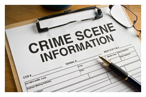 crime scene information report on a clipboard.