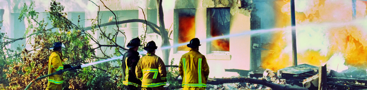firefighters at the site of a blaze.