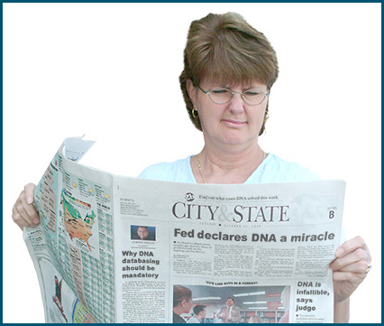 Image of a woman reading the newspaper with confusing headlines about DNA